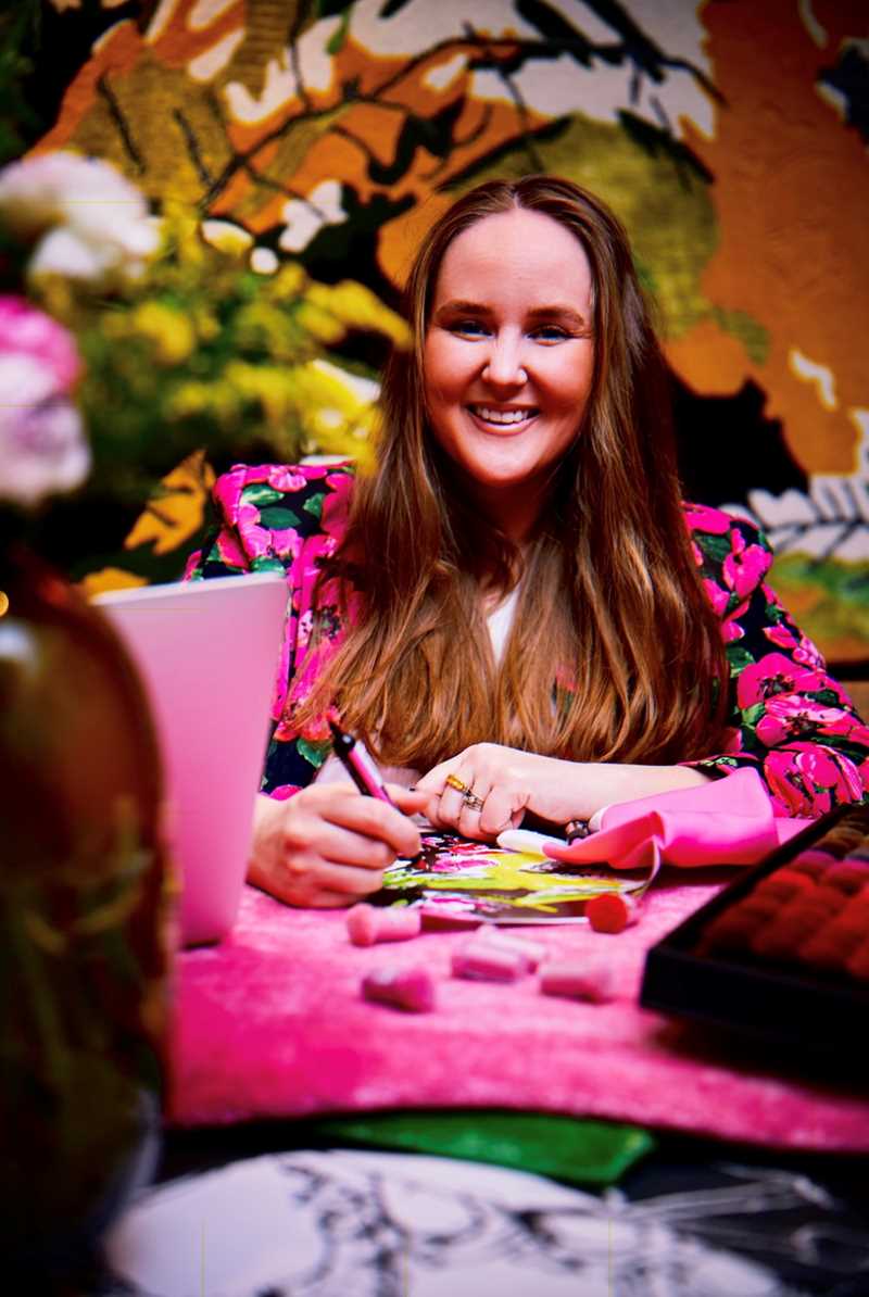 Portrait of a smiling woman with a colorful clothing.