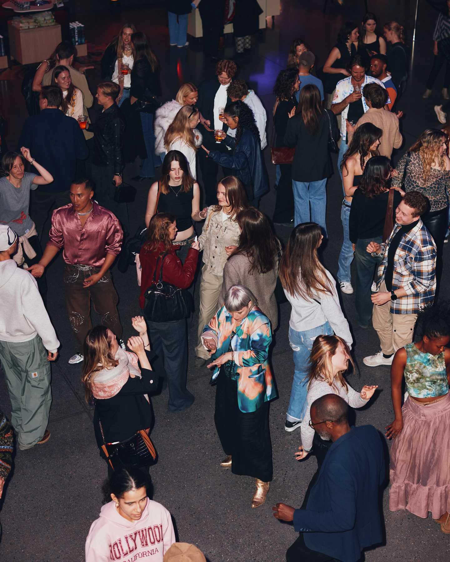 A full dance floor seen from above. Photograph.