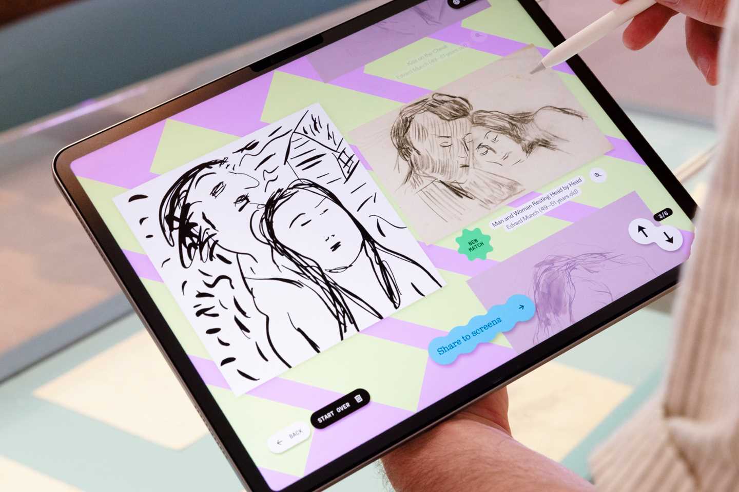 Close‑up of an iPad showing a drawing of a woman and a man, matched with a work by Edvard Munch from MUNCH’s drawing archive. Photograph.