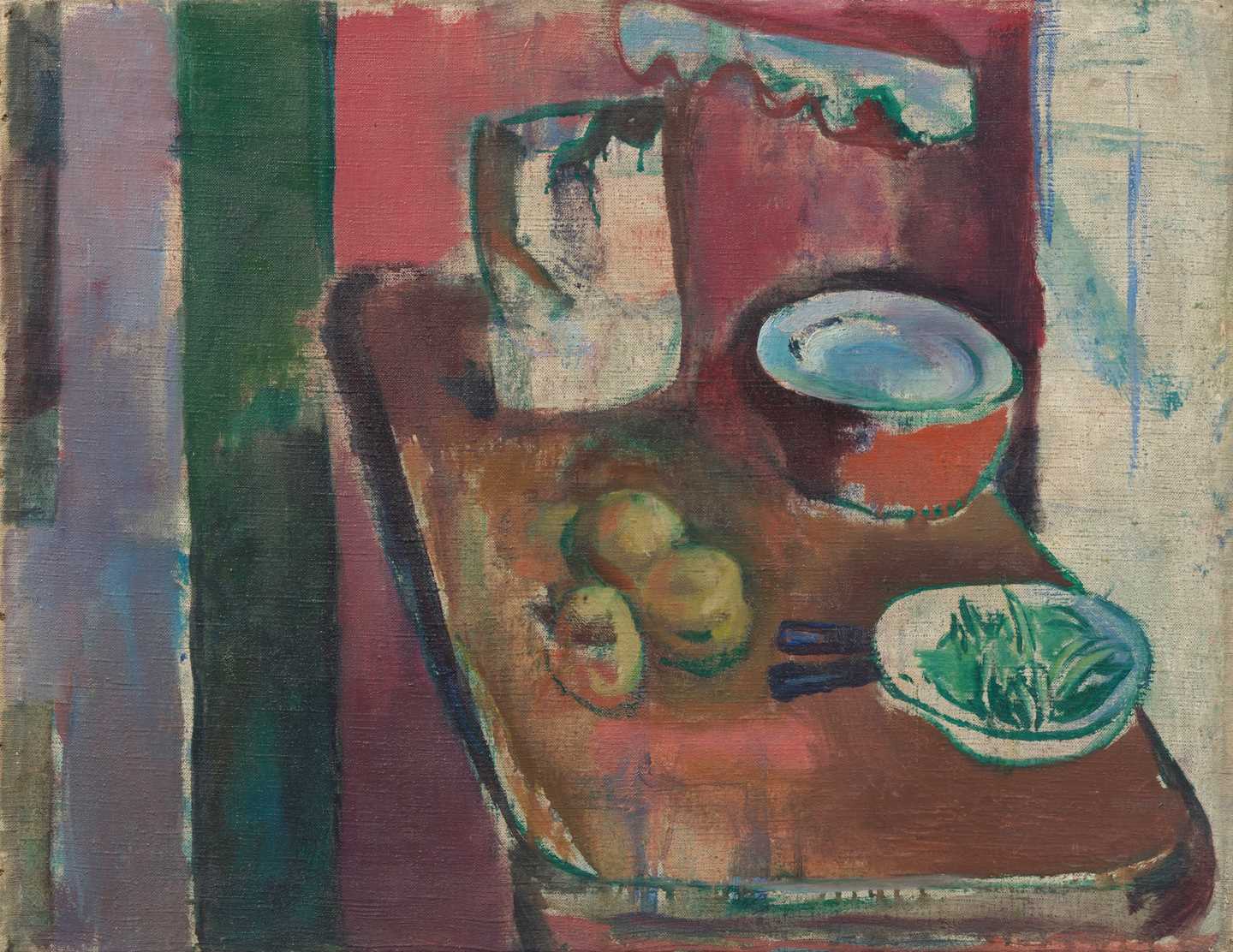 A kitchen counter with ingredients, pots and containers. The kitchen wall is painted red.
