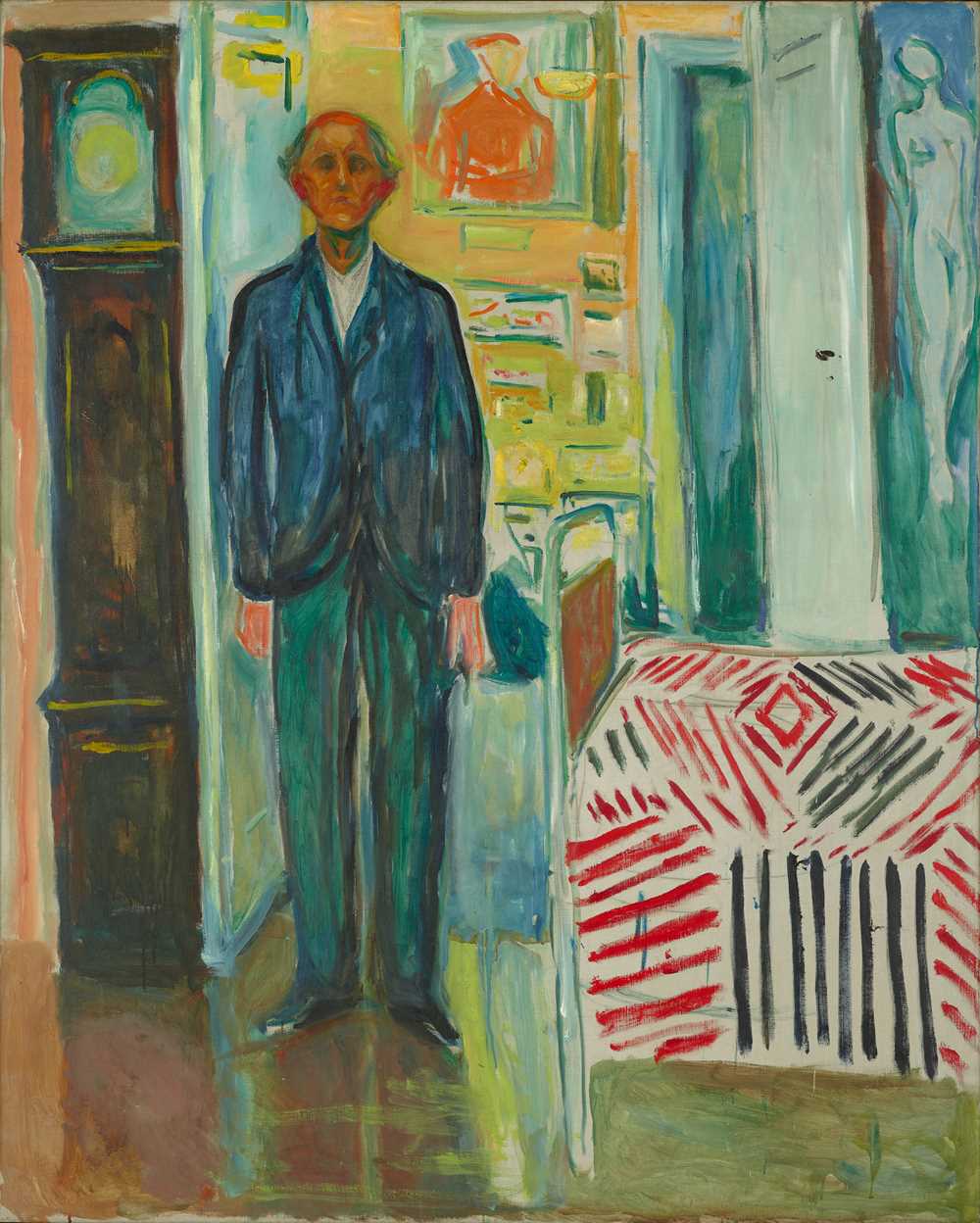 Edvard Munch: Self-Portrait. Between the Clock and the Bed, 1940–43. An old man stands upright with his arms hanging by his sides. To the right of the man, there is a bed; to the left, a grandfather clock. Painting.