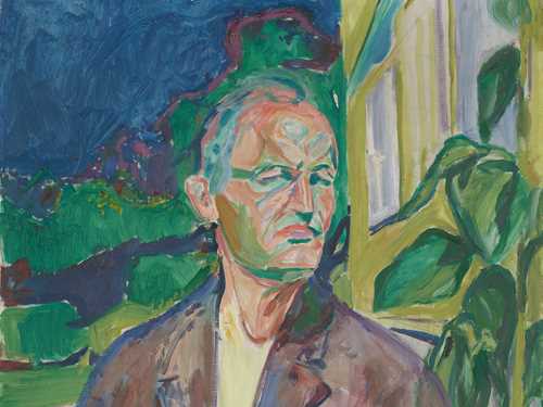 Edvard Munch: Self-Portrait in Front of the House Wall, 1926. Edvard Munch is shown in a half-length portrait standing in front of a yellow house wall with a green plant. He is wearing a brown blazer with something white underneath. His right arm hangs down by his side, while his left is raised to chest height as if about to grasp his lapel. Behind him, the house wall is visible on the right, while a green garden and a blue sky can be seen on the left. Painting.